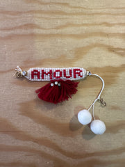 Bracciale di perline con nappine fatto a mano con scritta
